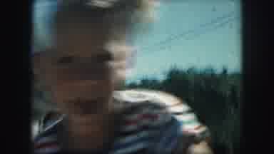 Kansas City Missouri (1959): A Rowdy Young Boy Riding His Bike With The