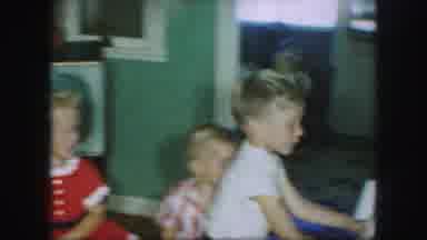 Kansas City Missouri (1959): Group Of Children Stacking Gifts In House
