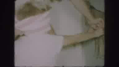 Kansas City Missouri (1959): A Child Wearing White Removing A Blindfold