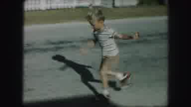 Kansas City Missouri (1959): Boy Child Skates Carefully Stride By Stride Down A
