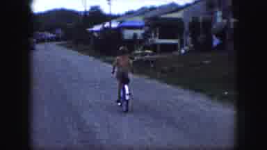 Kansas City Missouri (1959): Footage Of Children Riding Bikes Down The Street In