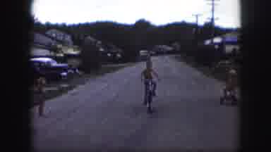 Kansas City Missouri (1959): Children Playing Riding A Bike In A Suburban Street