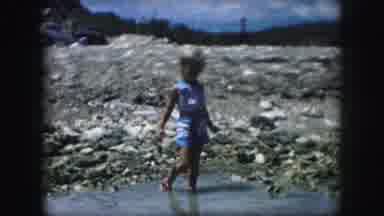 Kansas City Missouri (1959): Young Child Playing In The Water On A Rocky Beach On