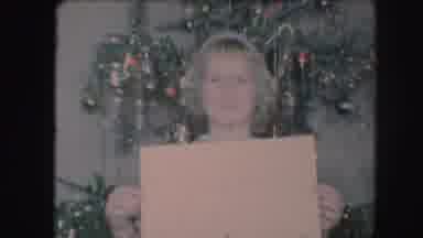 Kansas City Missouri (1959): Blonde Little Girl Holds Beige Sign Near Decorated