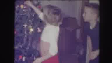 Kansas City Missouri (1959): Two Young Children Decorate Colorful Christmas Tree