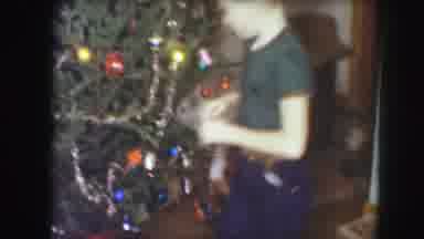 Kansas City Missouri (1959): Children Decorate A Nearly-Completed Christmas Tree A