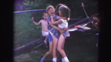 Kansas City Missouri (1959): Three Child Playing Hug In Field