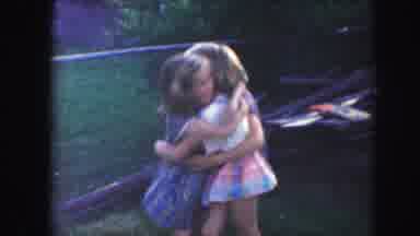 Kansas City Missouri (1959): Three Children In Group Hug While Woman Brings