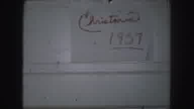 Kansas City Missouri (1959): A Person Makes A Handwritten Sign That Says Christma
