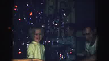 Kansas City Missouri (1959): Two Young Children In Pajamas Helping A Man Decorate