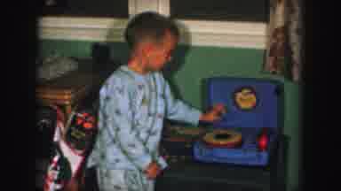 Kansas City Missouri (1959): Two Children In Pajamas Playing With A Toy Record