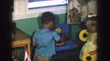 Kansas City Missouri (1959): Two Young Children Play Together With Games And