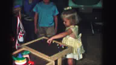 Kansas City Missouri (1959): Little Girl Playing A Games That Consists Of A Hammer