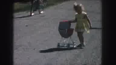 Kansas City Missouri (1959): Little Girl In Yellow Dress With A Red Doll Stroller