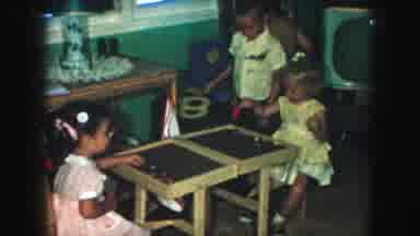 KANSAS CITY MISSOURI-1959: Five Children Playing With Toys In A Classroom