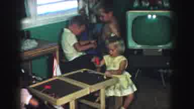 Kansas City Missouri (1959): Dad And Mom Plugging In Tv And Kids Playing With Toys