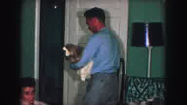 Kansas City Missouri (1959): Man In Blue Shirt Carrying Small Girl With White Bow