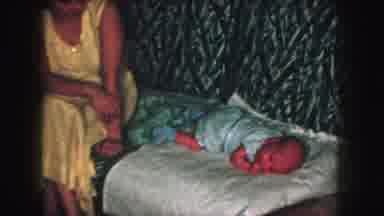 Kansas City Missouri (1959): A Woman Infant Child And Man Sitting On A Couch