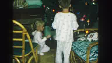 Kansas City Missouri (1959): Little Boy And Girl In Pajamas Putting Colorful