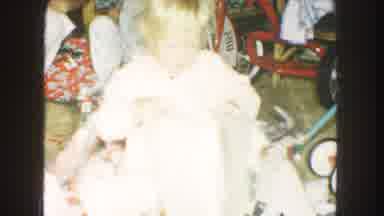 Kansas City Missouri (1959): Young Child Unwraps Her Many Presents On A Lovely