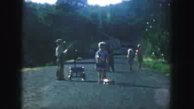 Kansas City Missouri (1959): Children Playing With Scooter And Wagon In The Road