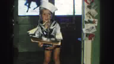Kansas City Missouri (1959): Cute Little Boy Plays With Toy Boat And Drops It