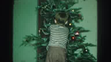 Kansas City Missouri (1959): Kid By A Christmas Tree Placing Ornaments On The