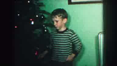 Kansas City Missouri (1959): Boy Adding Ornaments To Christmas Tree In Mid-Century