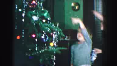 Kansas City Missouri (1959): Two Little Boys Decorating Throwing Tinsel On