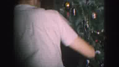 Kansas City Missouri (1959): People Having Fun Decorating A Christmas Tree In Old