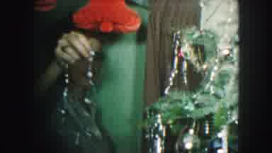 Kansas City Missouri (1959): People Enjoying Christmas Activities Like Trimming