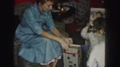 Kansas City Missouri (1959): Two Children And Their Mother Opening Christmas