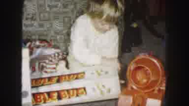 Kansas City Missouri (1959): Child In White Pajamas Opening Toy Box On Christmas