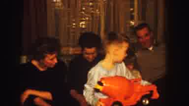 Kansas City Missouri (1959): Kid Shows Off New Toy As Family Watches