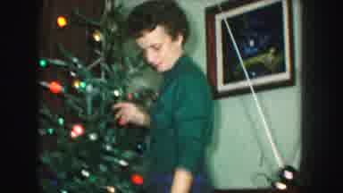 Kansas City Missouri (1959): Family Dancing Hanging Ornaments And Bending Over On