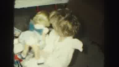 Kansas City Missouri (1959): Little Girl Playing With Doll She Is In Her Nightgown
