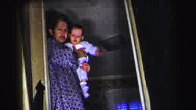 Lynbrook New York (1975): Grandma Holding Baby And Walking Outside Front Door They