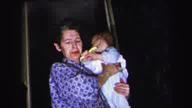 Lynbrook New York (1975): An Old Woman Holding An Infant Then Two Infants Opening