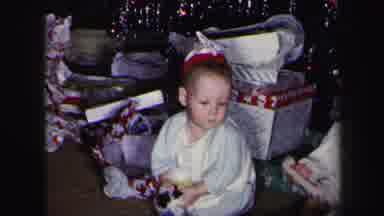 Lynbrook New York-1975: Young Children In Jammies Sitting In Front Of Presents