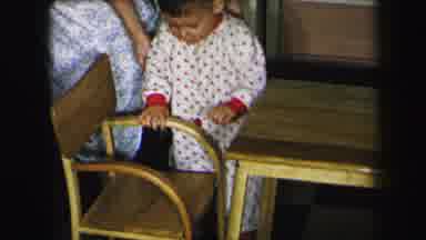 Lynbrook New York (1975): A Young Toddler In A White And Red Polka Dot Outfit