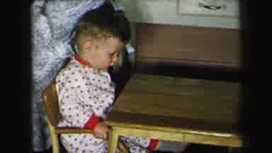 Lynbrook New York (1975): Two Young Toddlers In Matching Outfits Being Sat Down At
