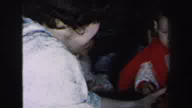 Lynbrook New York (1975): A Lady Is Showing The Toy Car Gift To The Little Baby