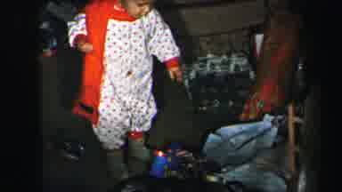 Lynbrook New York (1975): Child Toys Playing Picking Up Moving Pajamas Scarf Dog
