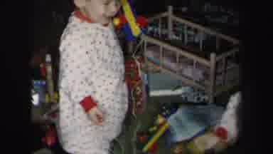 Lynbrook New York-1975: Toddler Playing With Toys In Pajamas