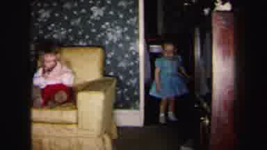 Lynbrook New York (1975): A Child Sits On A Chair And Another Child Throws