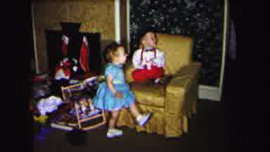Lynbrook New York (1975): White Girl And Boy In A Living Room Girl Is Moving
