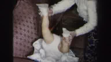 Lynbrook New York (1975): The Baby Was Playing With The Mother On Sofa