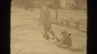 Lincoln Nebraska USA-1975: Very Old Black And White Movie Of A Man That Tows A Child On A Sled