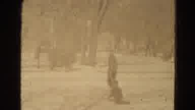 Lincoln Nebraska USA-1975: Adult Slowly Pulls Child In Sleigh Through Fresh Snow