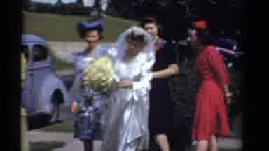 Bridgeport Connecticut (1975): Man Holds Up Two Bouquets As He Mugs The Camera